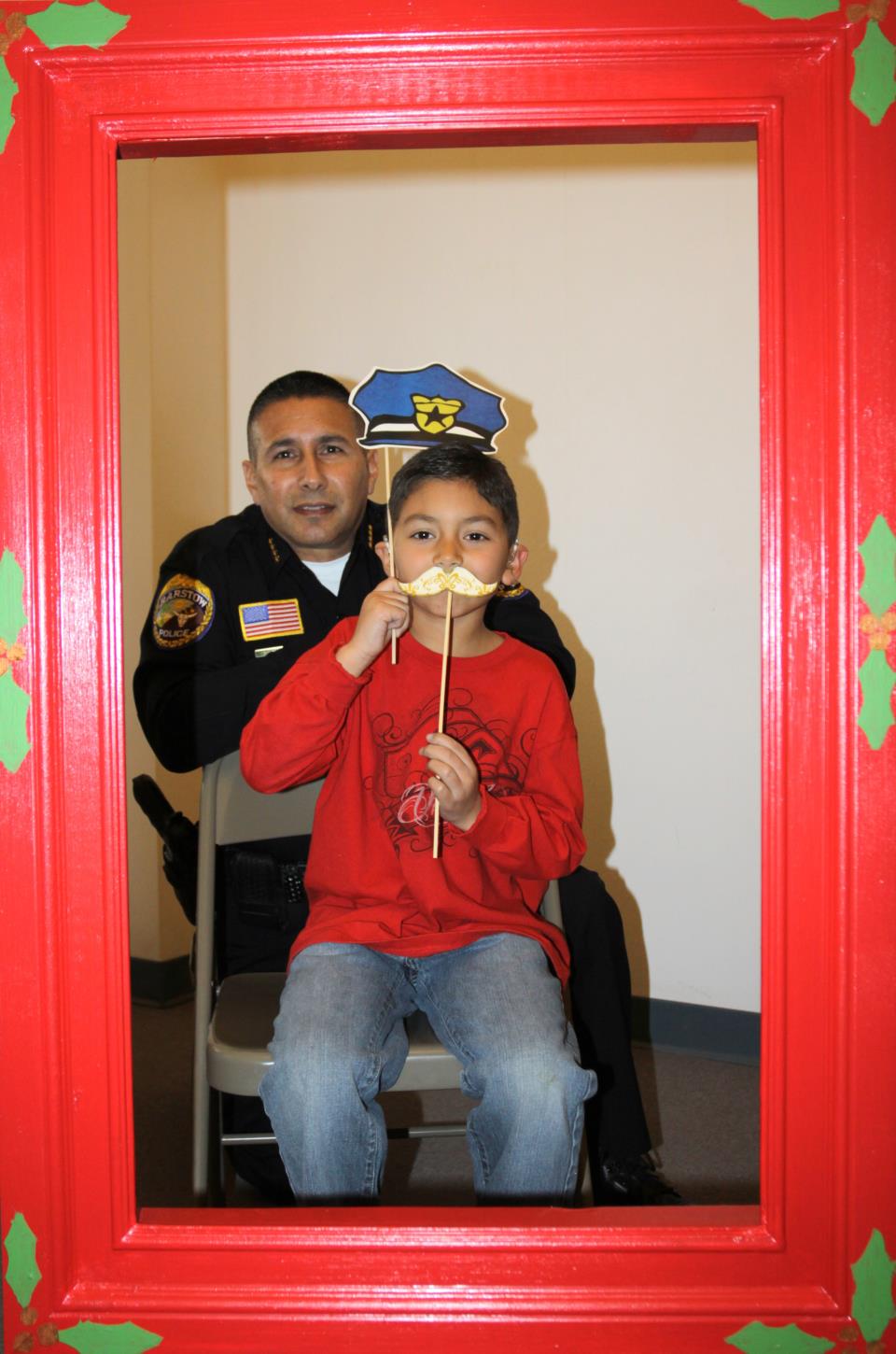 Chief Ramirez and PAL member pose for Christmas Photo